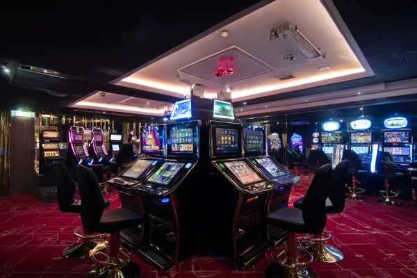 A person using their device against a moody casino-themed background, illustrating the smooth re-entry process at PAGASAS.
